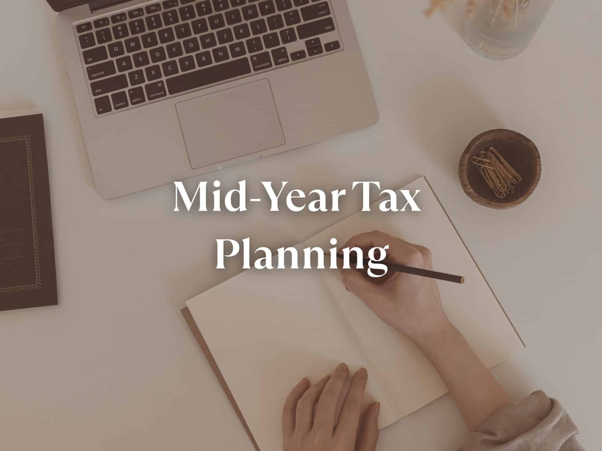 "Person writing at a desk with the words 'Mid-Year Tax Planning' — representing small business financial planning, bookkeeping review, and estimated tax strategies with C Squared Accounting."
